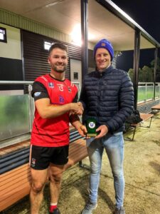 Intermediate football final player of the game Eddie Goggin (left) with Gaelic Gaems Victoria President Conor Hennessey